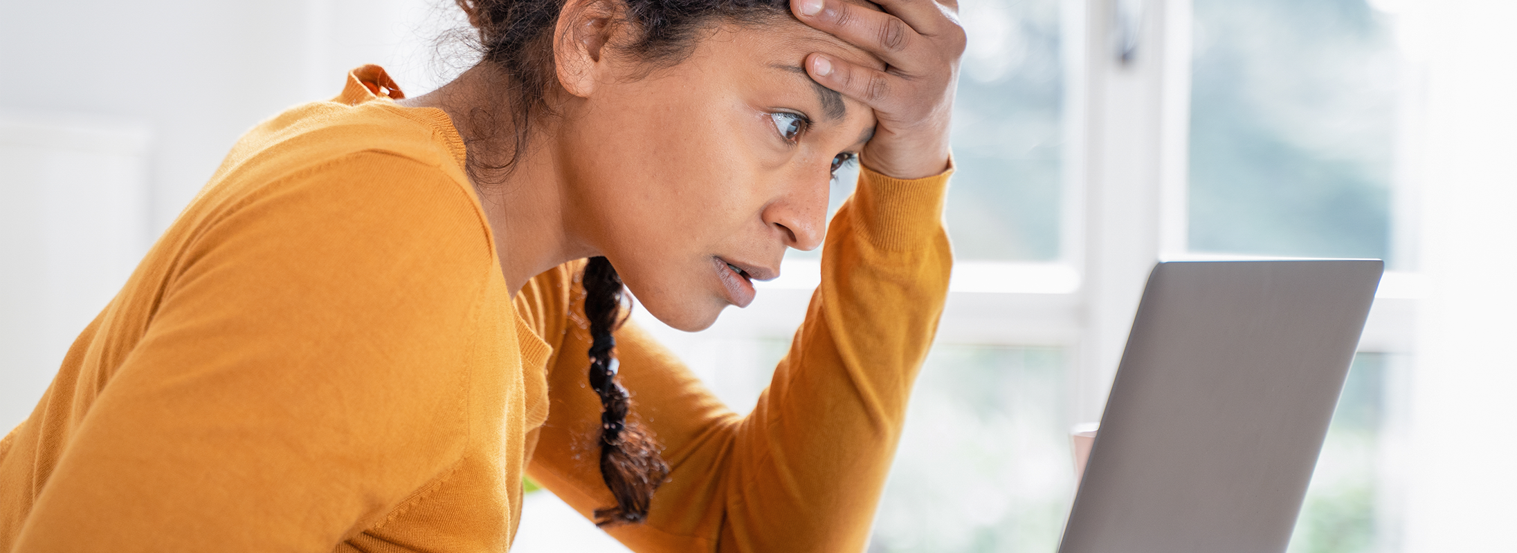 Woman looking at laptop